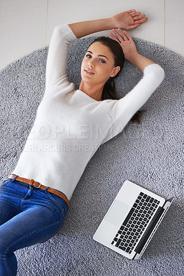 Buy stock photo Happy woman, portrait and lying with laptop on floor for break, rest or research at home. Top view of female person or freelancer with smile, computer and relax on rug or mat for networking at house