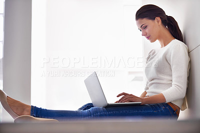 Buy stock photo Laptop, typing and woman in home for remote work, social media or reading email on internet. Computer, freelancer and person on floor with technology for network, relax or blog on website in house