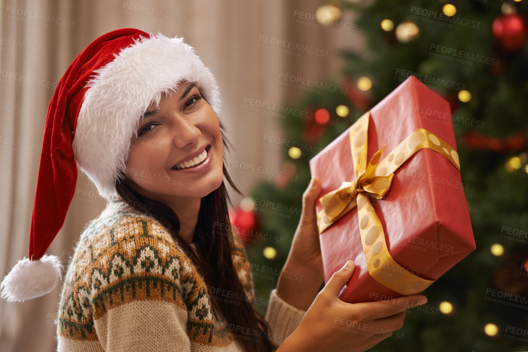 Buy stock photo Christmas, smile and portrait of woman with present at her home for festive celebration, event or party. Excited, happy and female person with gift box for xmas surprise in living room at apartment.