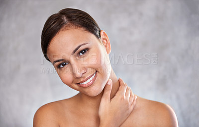 Buy stock photo Portrait, natural beauty and woman with smile for cosmetic care, shine and hand touching skin on grey background. Dermatology, wellness and hygiene, moisturizing body for glow and clean skincare