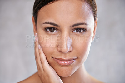 Buy stock photo Face, natural beauty and woman with cosmetic care, shine and hand touching skin on grey background. Dermatology, wellness and hygiene in portrait, moisturizing facial for glow and clean skincare