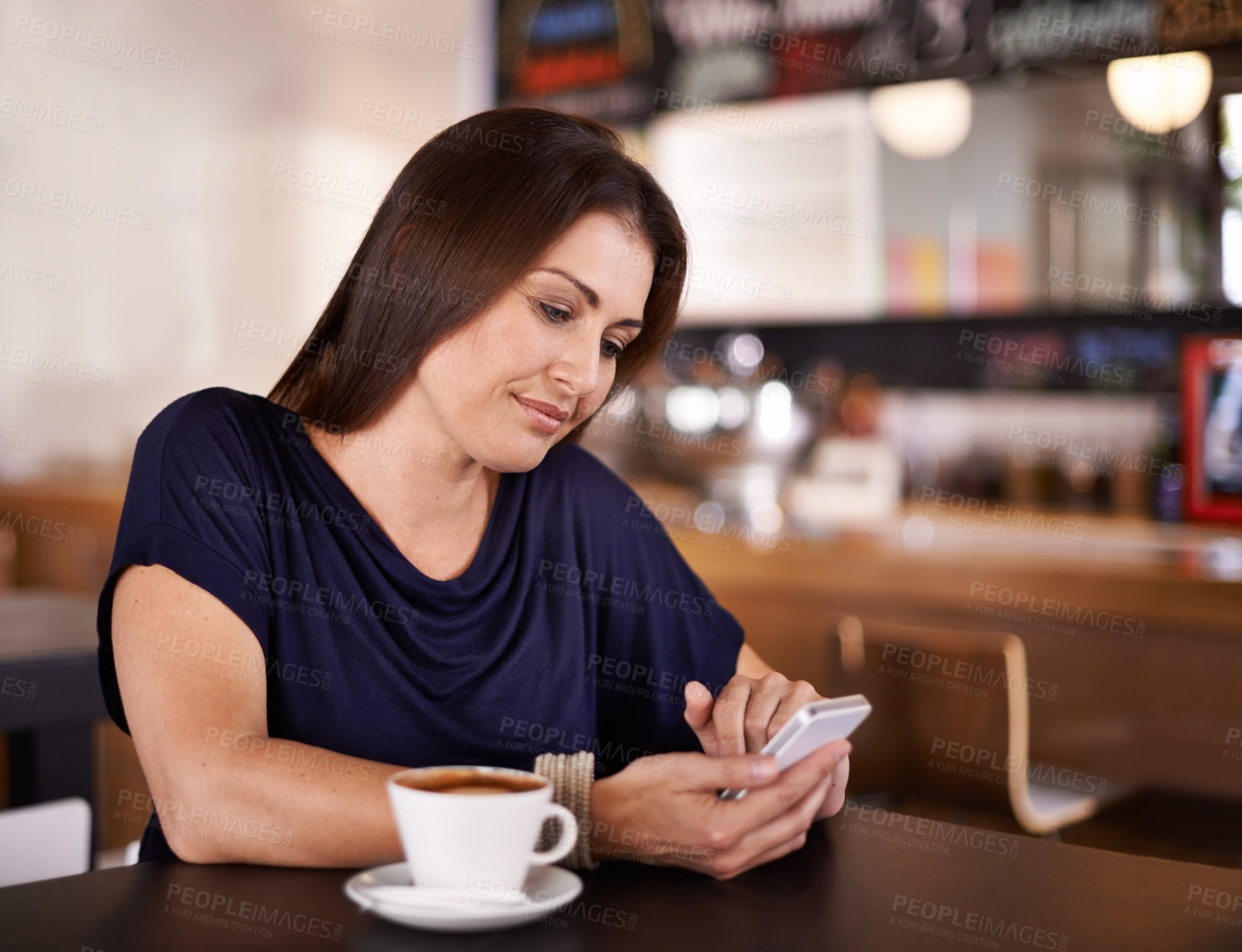 Buy stock photo Woman, reading and phone on social media in cafe and customer relax with latte in restaurant. Happy, person and scroll smartphone online with news, article or review coffee shop on blog website