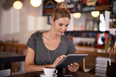 Buy stock photo Happy woman, tablet and research with coffee at cafe for communication, social media or networking. Female person or freelancer with smile for technology, online browsing or app at indoor restaurant