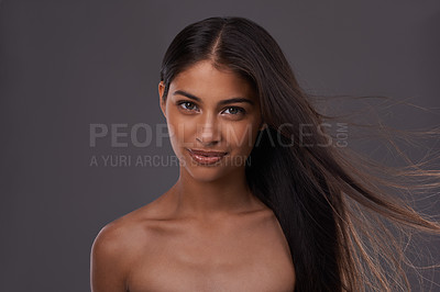 Buy stock photo Hair care, wind and portrait of woman with beauty, shine or skincare isolated on a gray studio background. Hairstyle, cosmetics and face of Indian model in salon with makeup at hairdresser for glow