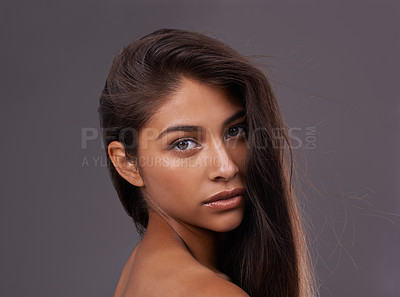 Buy stock photo Portrait, hair care or skincare of woman in makeup, glow or shine isolated on gray studio background. Face, hairstyle or serious Indian model in cosmetics at salon for beauty treatment at hairdresser