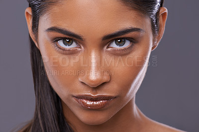 Buy stock photo Portrait, skincare and beauty of woman in makeup, glow or shine isolated on gray studio background. Face, serious and Indian model in cosmetics in spa for facial treatment, dermatology or skin health