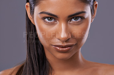 Buy stock photo Portrait, skincare and beauty of woman in makeup, glow or shine isolated on gray studio background. Face, cosmetics and young Indian model in spa for facial treatment, dermatology and skin health