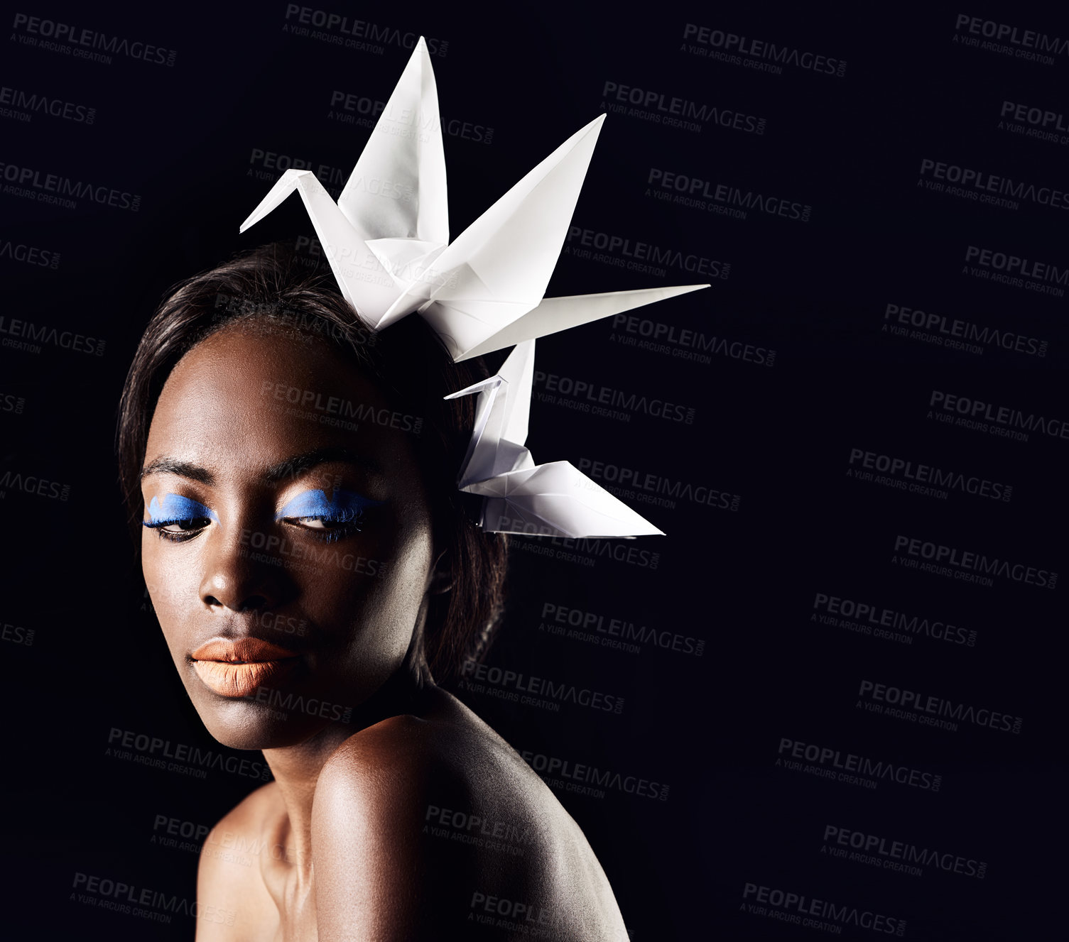 Buy stock photo Studio, beauty and cosmetics for black woman with origami  in dark background with aesthetic for luxury. Eyeshadow, glow and foundation on face of girl for shine, African female person and makeup