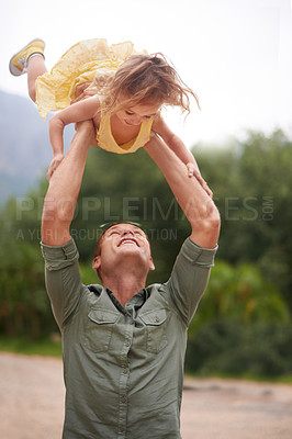 Buy stock photo Father, child and lifting outdoor for play together in nature on holiday vacation for love connection, game or adventure. Male person, daughter and happiness in Australia for bonding, fun or travel