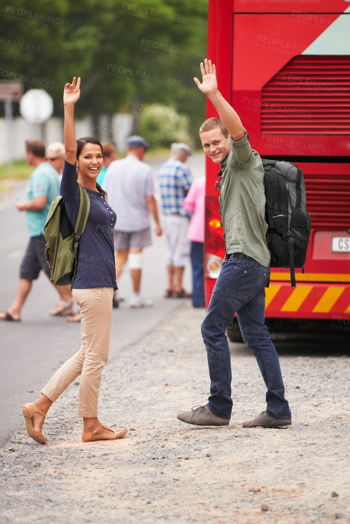 Buy stock photo Couple, happy and wave for bus, travel and backpack for adventure, journey or transportation on street. Man, woman and smile outdoor in portrait with vehicle for road trip for vacation in Costa Rica