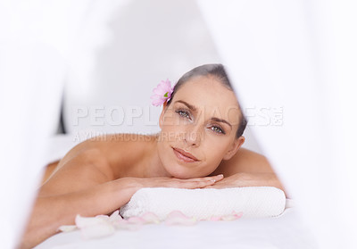 Buy stock photo Relax, massage and portrait of woman at hotel spa for health, wellness and luxury holistic treatment. Self care, peace and calm girl on table for muscle therapy, comfort and zen body pamper service