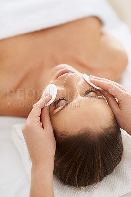 Buy stock photo Woman, pad and facial massage for cosmetics treatment to relax, cleaning and beauty therapy for skin care. Female person, calm and serene or dermatology, closeup and rest at hotel and peace or zen