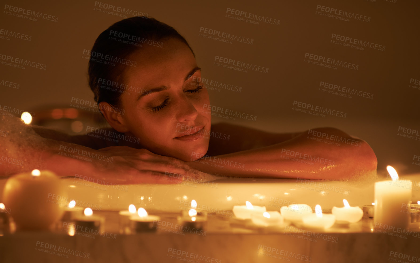 Buy stock photo Woman, bathtub and candles for spa care with relax cleaning routine with bubbles for treatment, hygiene or wellness. Female person, calm and stress relief skincare with peace resting, tub or comfort