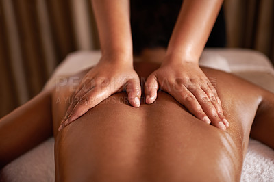 Buy stock photo Rearview shot of a woman getting a massage at a spa