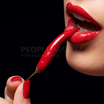 Buy stock photo Chili, red lipstick and closeup of woman lips in studio with trendy, beauty and manicure treatment. Mouth, cosmetics and female person with nail polish eat pepper for cosmetology by black background.