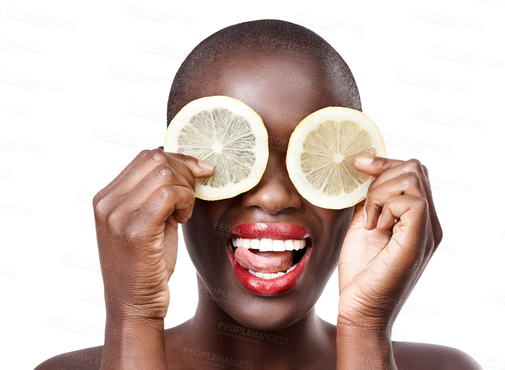 Buy stock photo Studio shot of a beautiful model holding lemon slices up to her eyes
