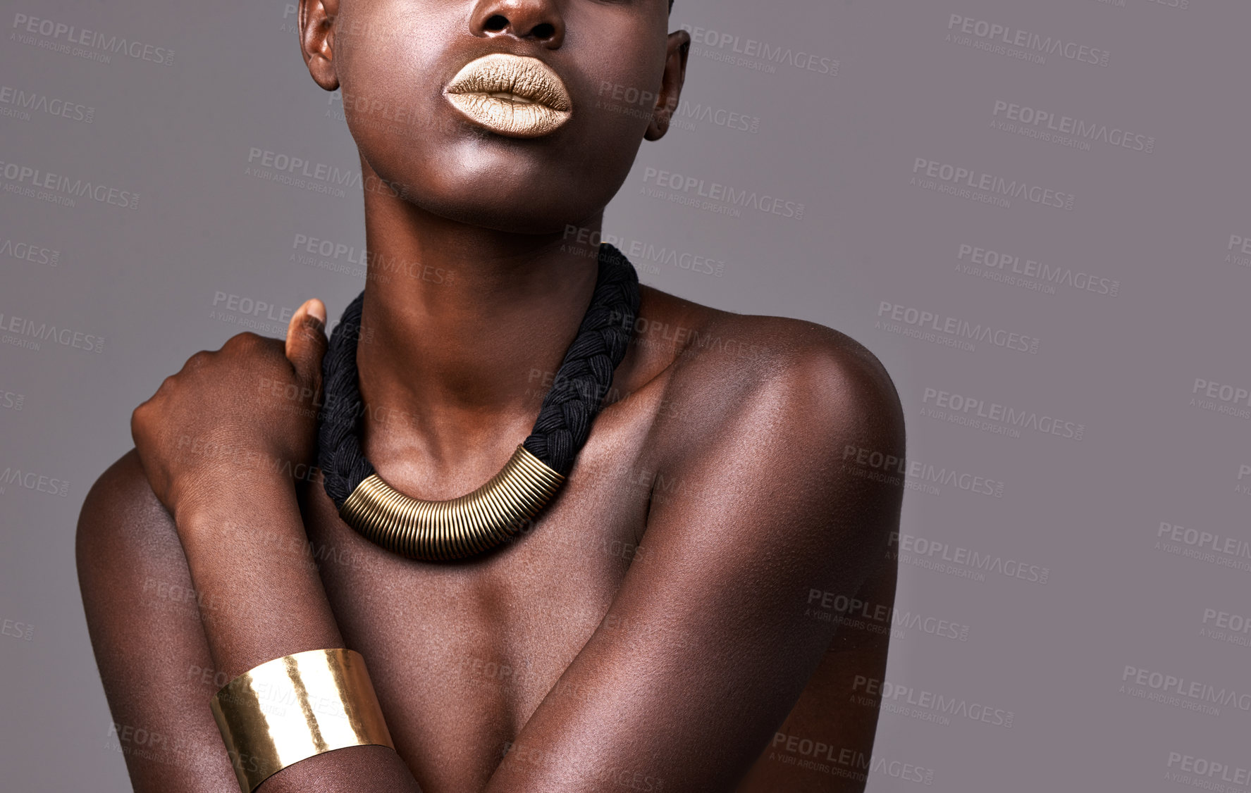 Buy stock photo Cropped studio shot of a beautiful semi-dressed woman wearing jewelry