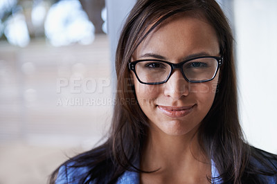 Buy stock photo Portrait of a successful young businesswoman standing by a window