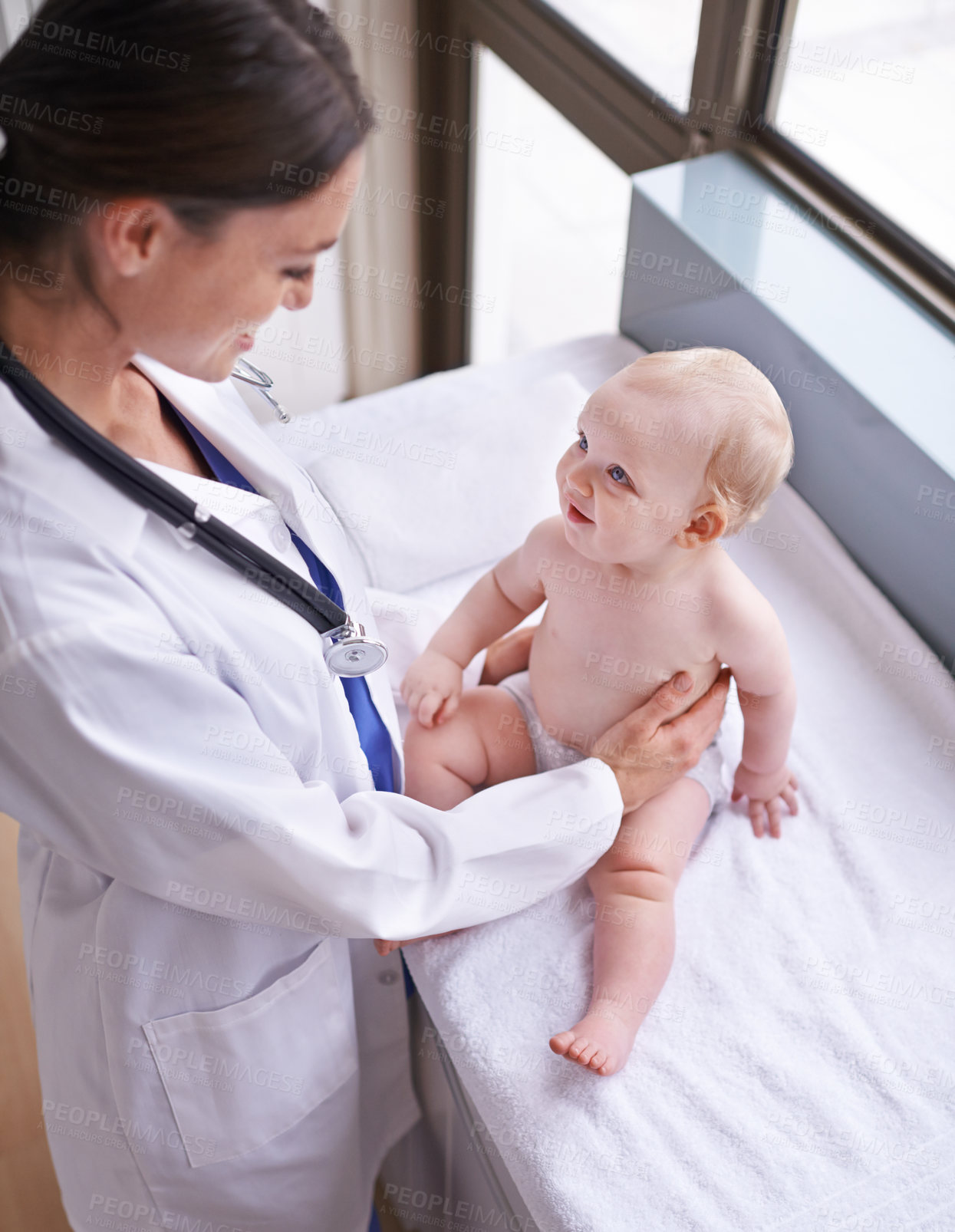 Buy stock photo Healthcare, pediatrician and woman with baby, boy and checkup with wellness and doctor in a clinic. Medical, cheerful professional or employee with smile and happy infant with appointment or medicare