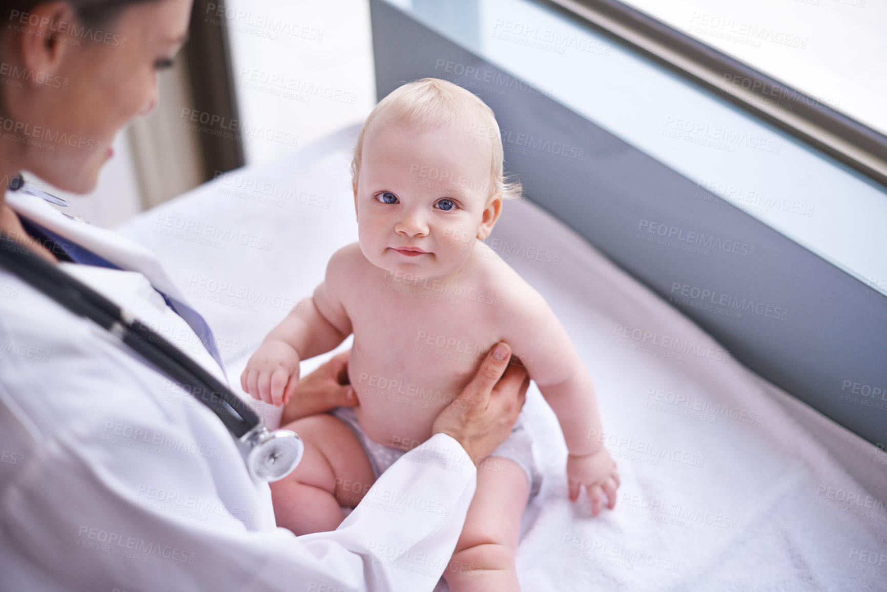 Buy stock photo Clinic, pediatrician and woman with baby, medical and checkup with wellness, consultation and doctor. Hospital, professional and employee with healthcare and infant with appointment and medicare