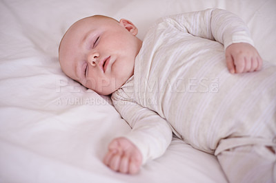 Buy stock photo Baby, bed and sleeping in house for relax nap in pajamas for health development growth in nursery, wellbeing or morning. Kid, calm and comfortable youth in apartment for resting, family home or peace