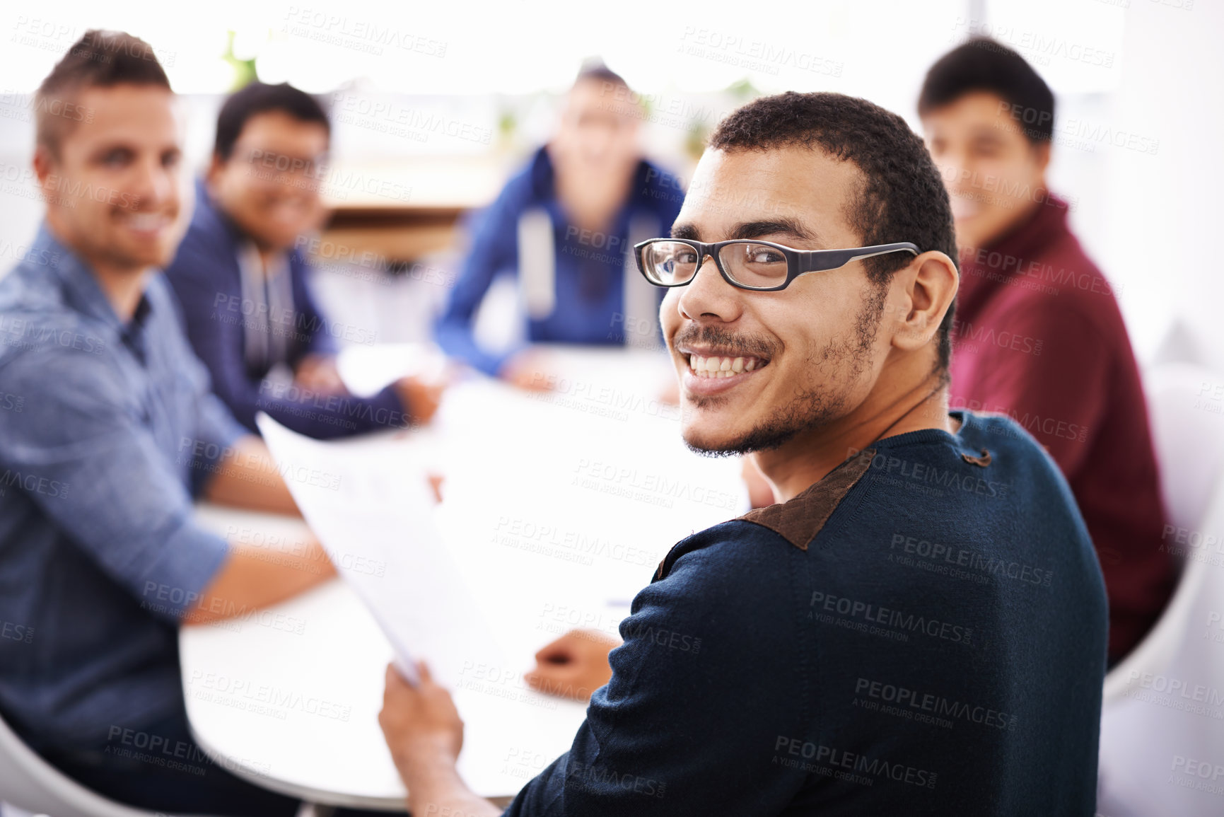 Buy stock photo Shot of a group of guys having a meeting