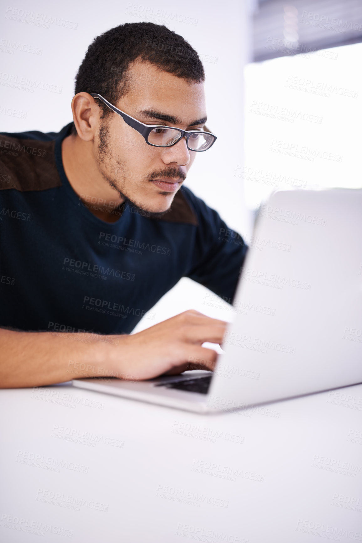 Buy stock photo Elearning, glasses and man typing on laptop for research, study or opportunity for university education. Computer, knowledge and college student with online course for programming, software or coding