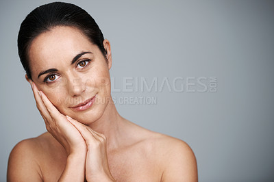 Buy stock photo Portrait, mature and skincare of woman touching face in makeup at studio isolated on gray background. Cosmetics, hands or beauty of model in treatment for dermatology, anti aging and mockup space