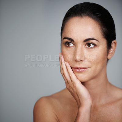 Buy stock photo Beauty, skincare and woman touching face in makeup at studio isolated on a gray background mockup. Cosmetics, hand and model in facial treatment for dermatology, thinking and health for anti aging
