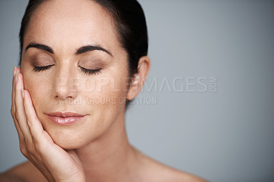 Buy stock photo Beauty, mature and skincare of woman touching face with makeup at studio isolated on gray background mockup. Cosmetics, hand and model in facial treatment for dermatology, anti aging and eyes closed
