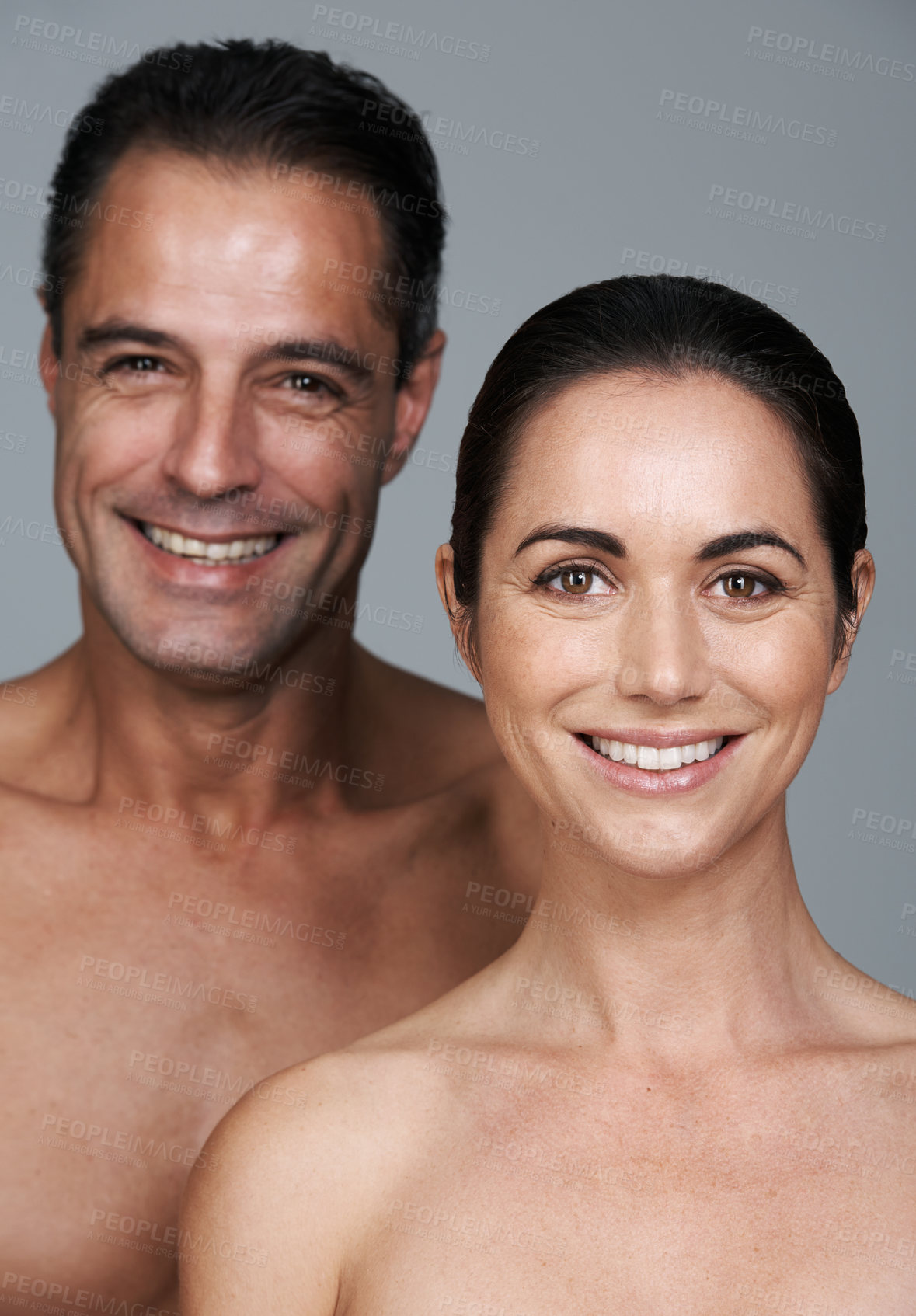 Buy stock photo Couple, portrait and skincare in studio, beauty and collagen cosmetics for anti aging. Mature people, facial treatment and dermatology for health on gray background, smile and together for wellness