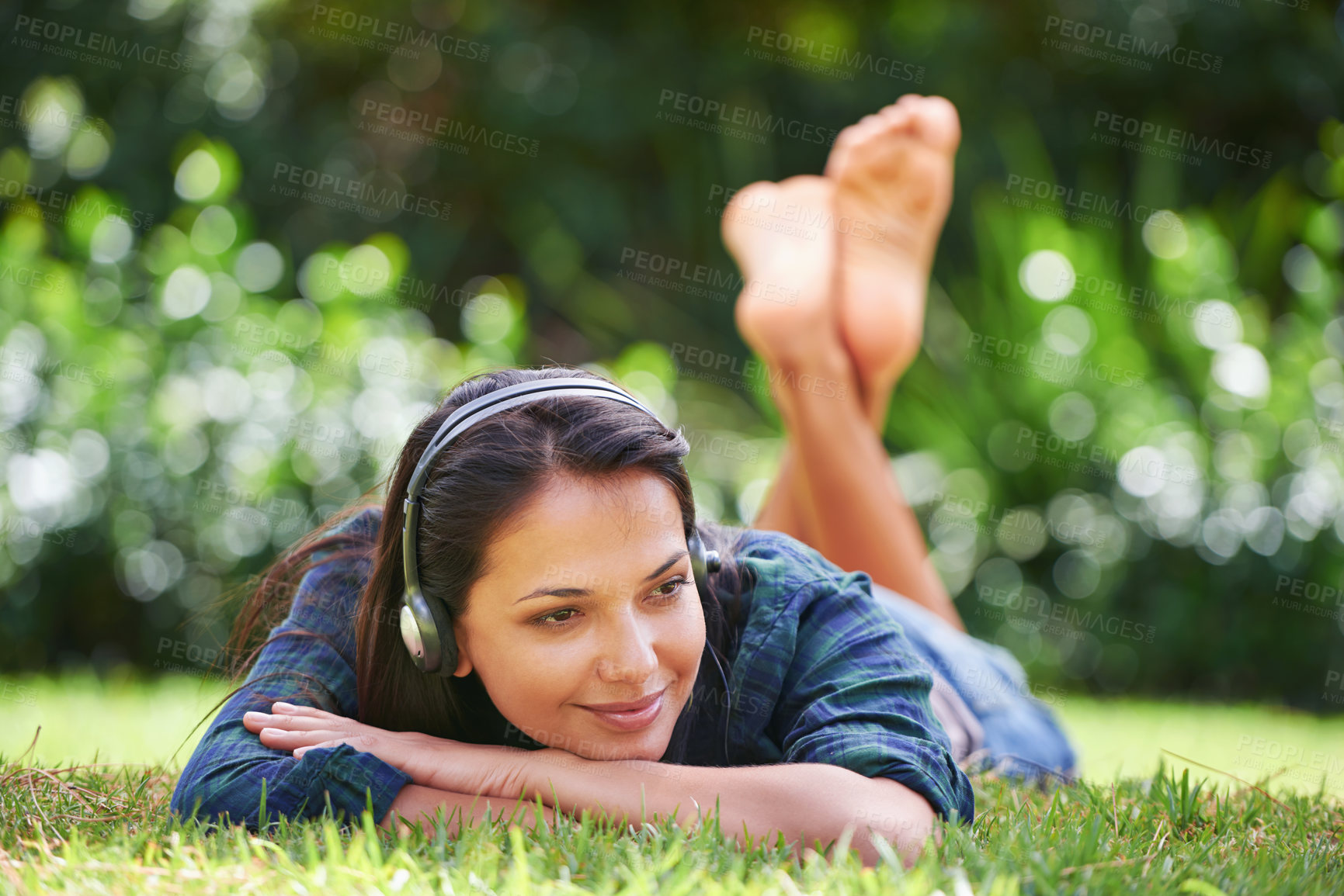 Buy stock photo Grass, thinking and woman with headphones, relax and streaming music with peace, sound and sunshine. Person in a park, outdoor and girl with headset and podcast with radio and weekend break in garden