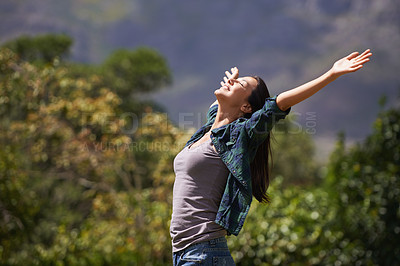 Buy stock photo Freedom, joy and relax for woman in outdoor, garden or forest for bliss, satisfaction and fulfillment. Young person, smile with arm in air for optimism, happiness and excited in environment on mockup