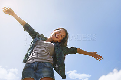 Buy stock photo Portrait, blue sky and arms with a woman outdoor in nature for fun, freedom or adventure in summer from below. Smile, health and wellness with a happy young female person outside to celebrate life