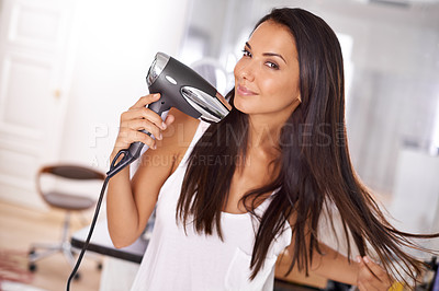 Buy stock photo Portrait, home and woman with dryer for hair, getting ready and happy grooming for straight hairstyle. Smile, face and girl in apartment with blowdryer for haircare, morning routine or heat treatment