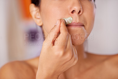 Buy stock photo Shot of a woman waxing her upper lip