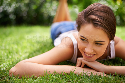 Buy stock photo Woman, thinking or happiness on grass for relax with sunshine, enjoyment or weekend break in summer. Young person, smile or thoughtful on lawn, garden or backyard of home for fresh air in environment