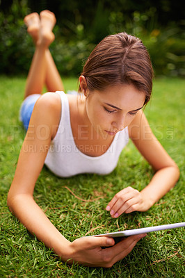 Buy stock photo Park, grass and woman relax with tablet, backyard, outdoor and garden to chat or text on social media. Summer, nature and girl online with connection to internet to read romance ebook on site of app