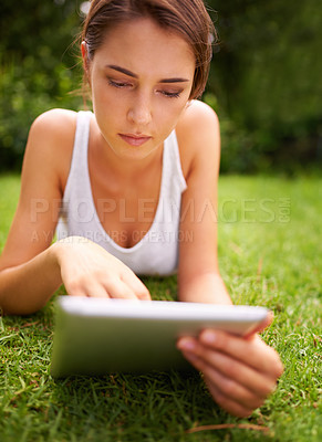 Buy stock photo Tablet, online and woman relax in backyard or park for social media for chatting and texting on site of app. Peace, nature and female person in summer with ebook, connection and internet for reading