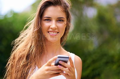 Buy stock photo Cellphone, nature and portrait of woman in park networking on social media, app or internet. Serious, technology and young female person scroll on a phone for communication in outdoor field or garden