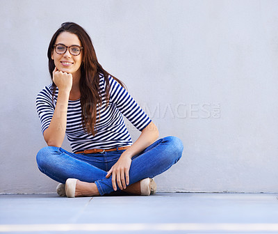 Buy stock photo Full-length portrait of a beautiful young woman sitting on the floor