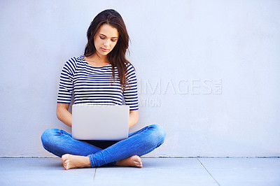 Buy stock photo Typing, woman and relax on floor with laptop for remote work or freelancing, web browsing and research for idea or project. Female person, casual and computer for internet, social media and blog.