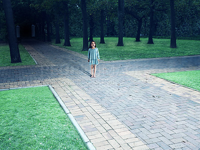 Buy stock photo Shot of a child standing in the centre of a four way intersection in the park - ALL design on this image is created from scratch by Yuri Arcurs'  team of professionals for this particular photo shoot