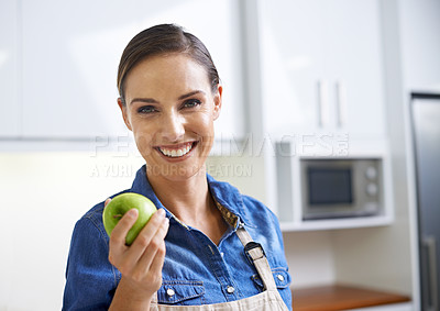 Buy stock photo Happy woman, portrait and kitchen with apple for diet, natural nutrition or healthy eating at home. Face of female person with smile and organic green fruit for vitamins, fiber or health and wellness