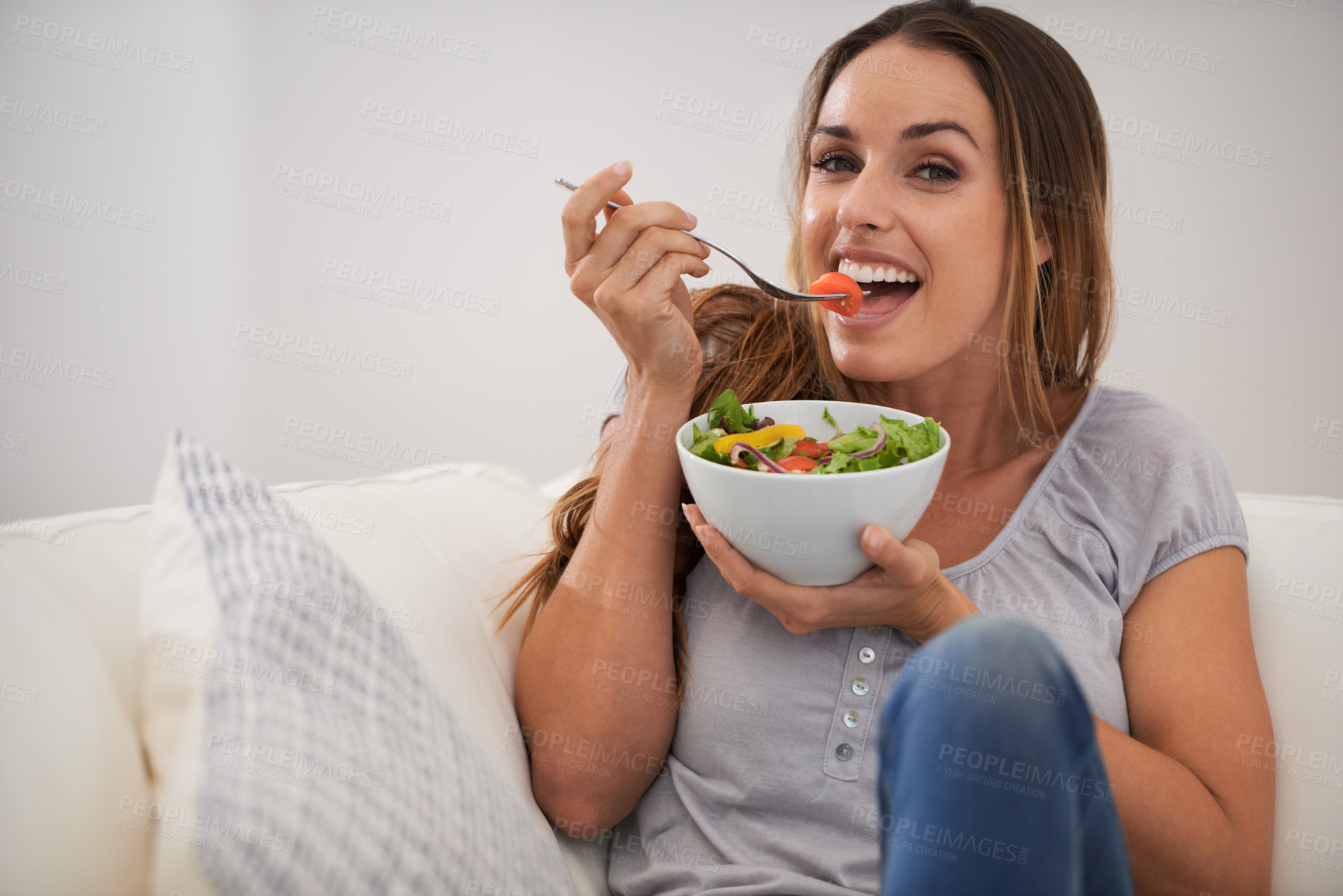 Buy stock photo Portrait, happy woman and eating a salad on couch, lunch and healthy food for nutrition in home. Smile, face and young lady with vegetables on sofa, vitamins and detox or weight loss in living room