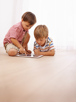 Buy stock photo Children, tablet and siblings on a floor with cartoon, gaming or streaming movie at home. Digital, learning and boy kids in house for google it, search or ebook storytelling, app or Netflix and chill