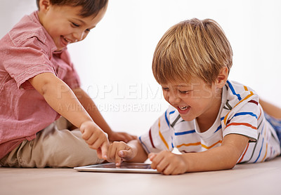 Buy stock photo Children, playing and tablet for learning and education in family home for happiness and fun. Male kids or friends together for play, laughing and streaming on internet for development with app video