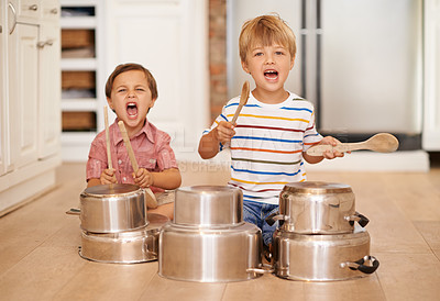 Buy stock photo Children, playing and pots for music or noise in family home or kitchen for happiness, fun and portrait. Male kids or friends together for a portrait, play and drum instrument for freedom and fantasy