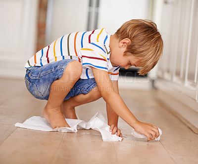 Buy stock photo Kid, cleaning and floor at home for mess, spill or household chores for childhood development.  Boy, toilet paper and responsibility in house with hygiene, maintenance and learning responsibility