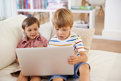 Buy stock photo Laptop, love and kid siblings on a sofa with cartoon, film or streaming movie at home. Computer, e learning or children in a living room for google it, search or gaming app, show or Netflix and chill